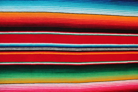 Mexico traditional cinco de mayo rug poncho fiesta background with stripes copy space