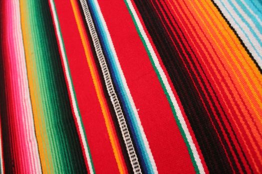 Mexico traditional cinco de mayo rug poncho fiesta background with stripes copy space