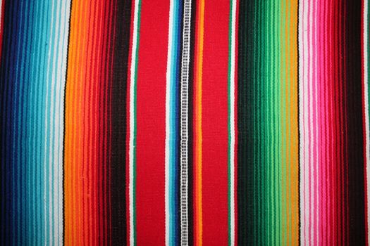 Mexico traditional cinco de mayo rug poncho fiesta background with stripes copy space