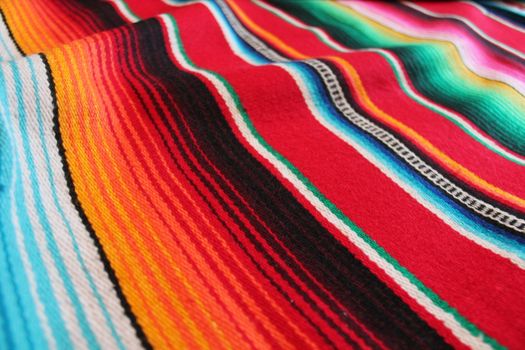 Mexico traditional cinco de mayo rug poncho fiesta background with stripes copy space