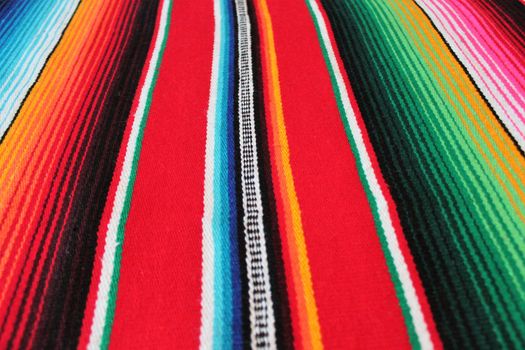 Mexico traditional cinco de mayo rug poncho fiesta background with stripes copy space