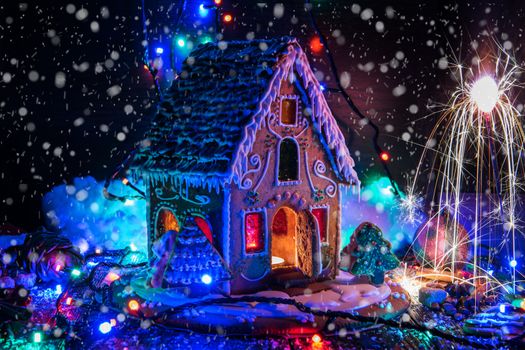 Gingerbread house with lights on dark background, xmas theme