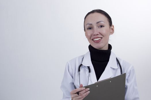 Young female doctor on a white background