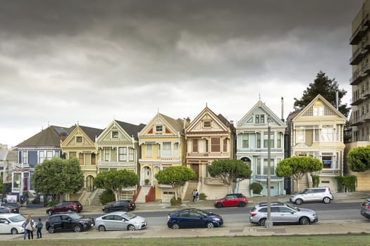 Victorian houses, known as the Painted Ladies with downtown in the background as viewed from Alamo Square in San Francisco, California