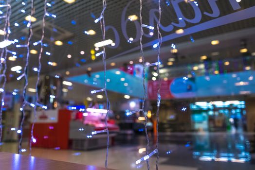 Shopping Mall Interior, Christmas Shopping Mall Defocused Background, Shopping Center, Abstract Blur Image of Shopping Mall and People on Christmas Time for Background