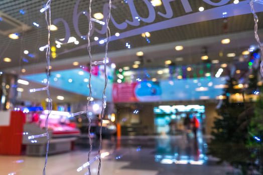 Shopping Mall Interior, Christmas Shopping Mall Defocused Background, Shopping Center, Abstract Blur Image of Shopping Mall and People on Christmas Time for Background