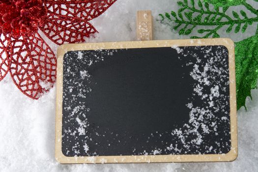 Blank blackboard on snow with Christmas decoration use for background