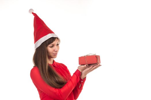 Young long-haired woman in red christmas cap and red gift box