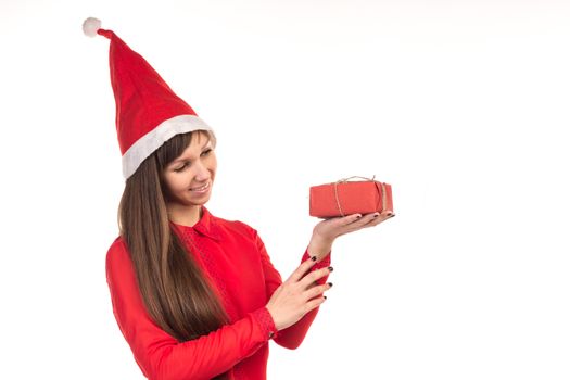 Young long-haired woman in red christmas cap and red gift box