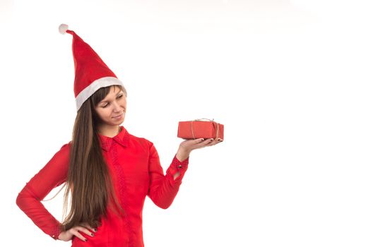 Young long-haired woman in red christmas cap and red gift box