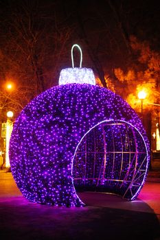 big gazebo in form of Christmas balls in winter park