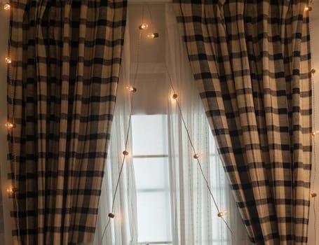 Brown curtains with garlands for Christmas holiday