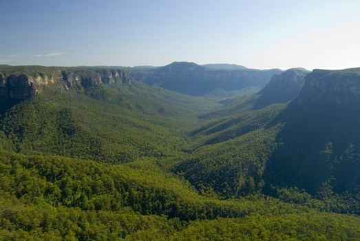 Picturesque view of the Blue Mountains, New South Wales, Australia, with a forested valley between high mountain peaks