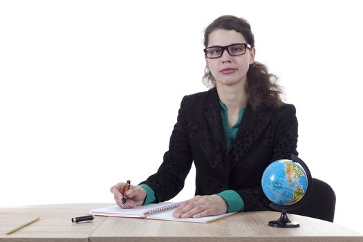 Strict woman teacher with a globe on a white background