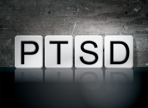 The word "PTSD" written in white tiles against a dark vintage grunge background.