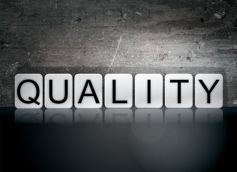 The word "Quality" written in white tiles against a dark vintage grunge background.