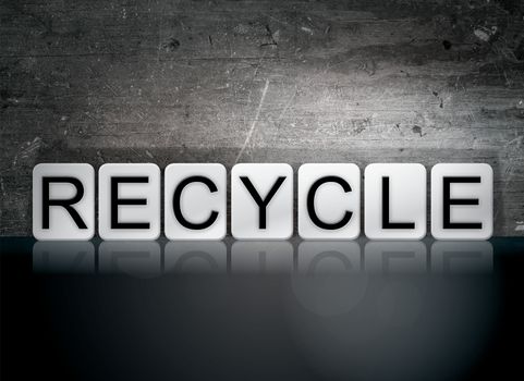The word "Recycle" written in white tiles against a dark vintage grunge background.