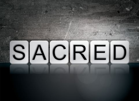 The word "Sacred" written in white tiles against a dark vintage grunge background.