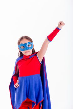 Girl in blue and red superhero costume with hand stretched out to fly