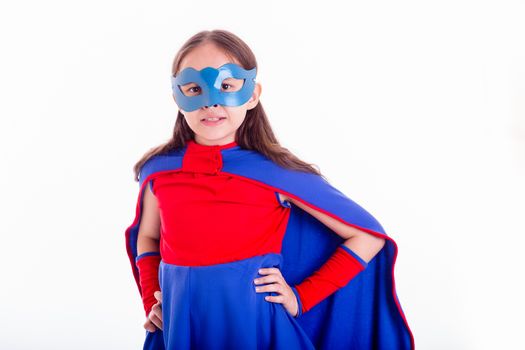 Girl in blue and red superhero costume with hands on hips