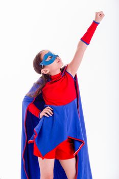 Girl in blue and red superhero costume with hand stretched out to fly