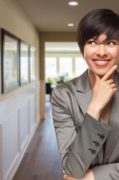 Attractive Curious Mixed Race Woman Inside Hallway of New House.