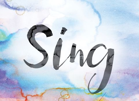 The word "Sing" painted in black ink over a colorful watercolor washed background concept and theme.