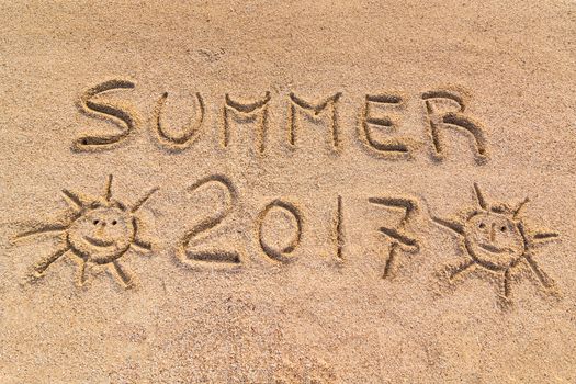 Handwritten on the sand "summer 2017"