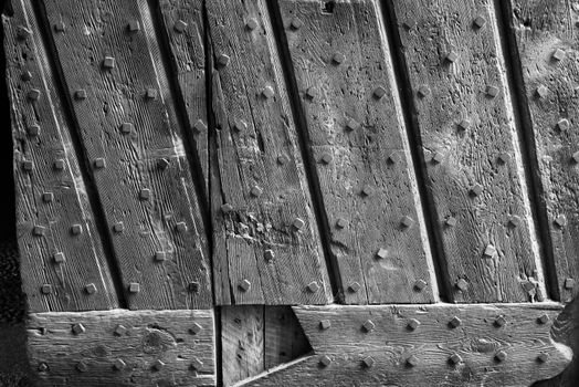 Sforzesco castle of Vigevano, Details of the wooden door.black and white photo.