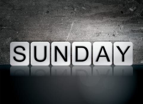 The word "Sunday" written in white tiles against a dark vintage grunge background.