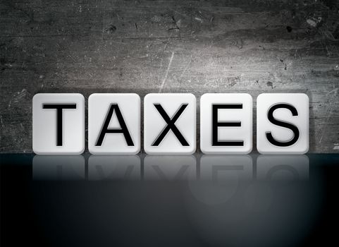 The word "Taxes" written in white tiles against a dark vintage grunge background.