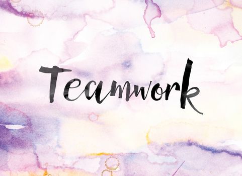 The word "Teamwork" painted in black ink over a colorful watercolor washed background concept and theme.