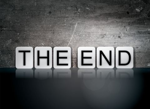 The word "The End" written in white tiles against a dark vintage grunge background.
