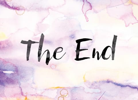 The word "The End" painted in black ink over a colorful watercolor washed background concept and theme.