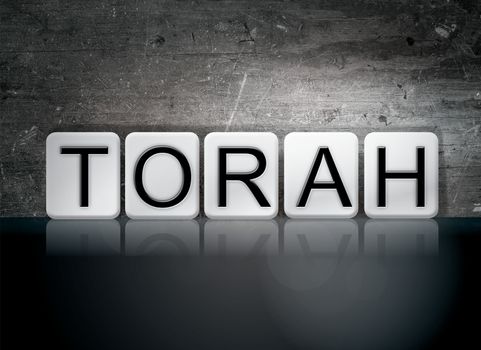 The word "Torah" written in white tiles against a dark vintage grunge background.