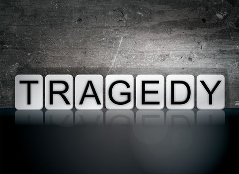 The word "Tragedy" written in white tiles against a dark vintage grunge background.