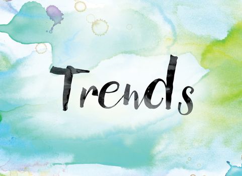 The word "Trends" painted in black ink over a colorful watercolor washed background concept and theme.