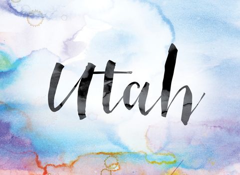 The word "Utah" painted in black ink over a colorful watercolor washed background concept and theme.