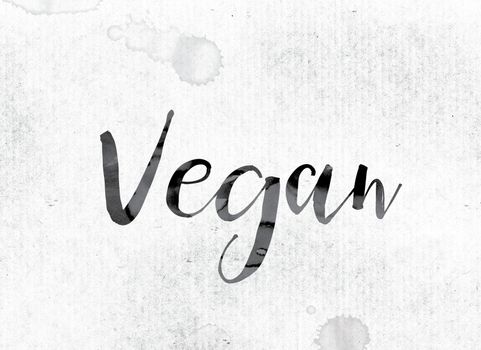The word "Vegan" concept and theme painted in watercolor ink on a white paper.
