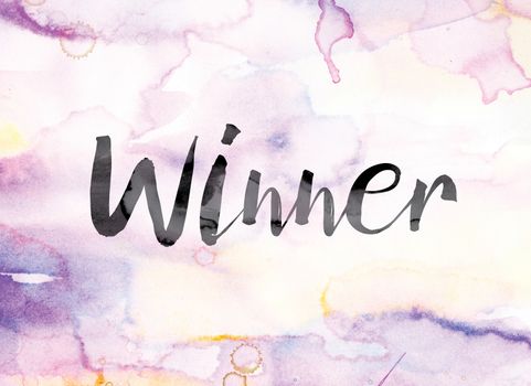 The word "Winner" painted in black ink over a colorful watercolor washed background concept and theme.