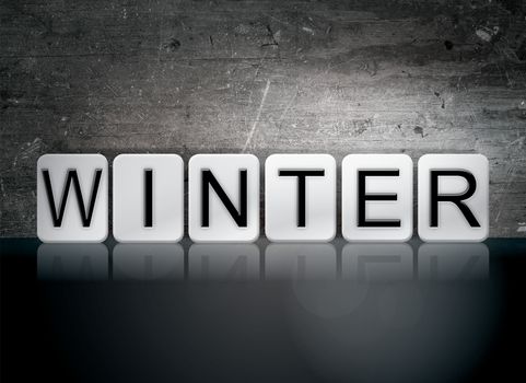 The word "Winter" written in white tiles against a dark vintage grunge background.