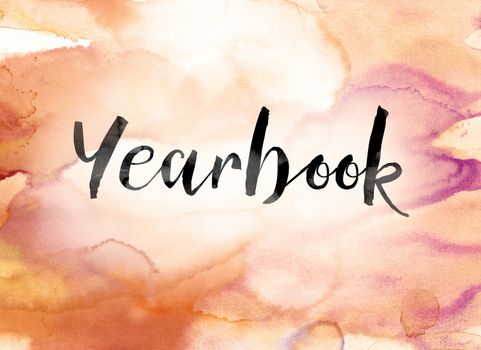 The word "Yearbook" painted in black ink over a colorful watercolor washed background concept and theme.