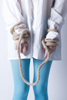 Crazy kind of young girl with hands tied with rope