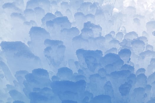 Block of blue smooth melting ice, close-up