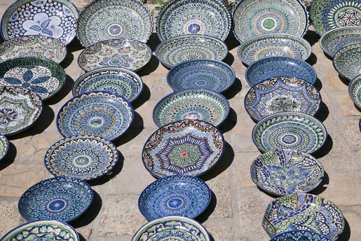 Traditional ceramic dishware in a street market, Uzbekistan
