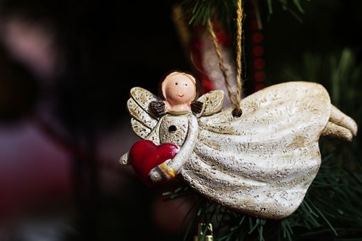 toy on the Christmas tree, Christmas angel. ornaments and symbols of Christmas