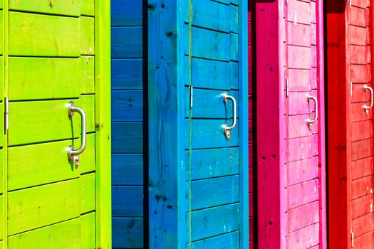 Beautiful colorful beach cabins closeup. Horizontal image.