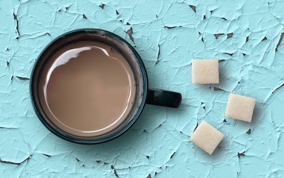 Cup of coffee on a blue wooden table