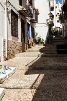 A street in the village of Peñíscola,Spain. Vertical image.