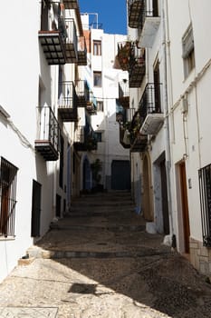 A street in the village of Peñíscola,Spain. Vertical image.